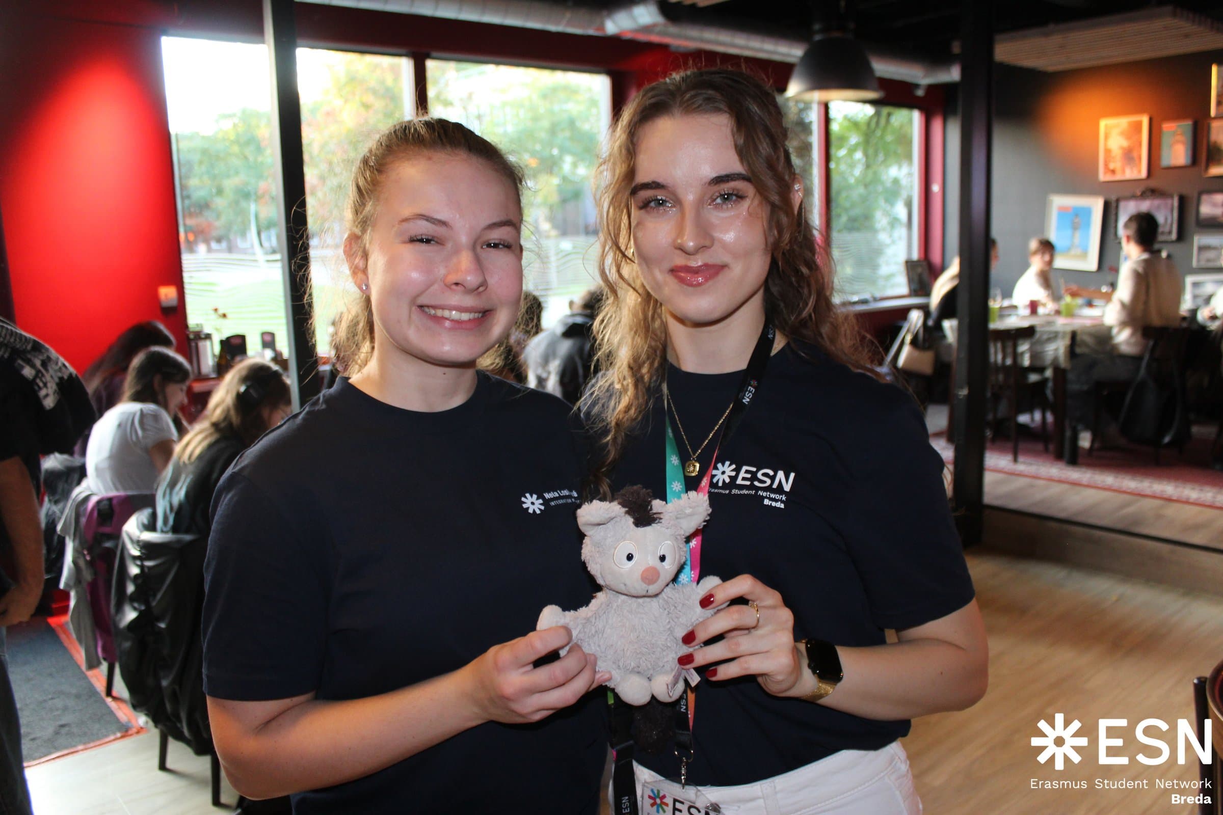 Kinga and an ESN Breda teammate holding the organization mascot