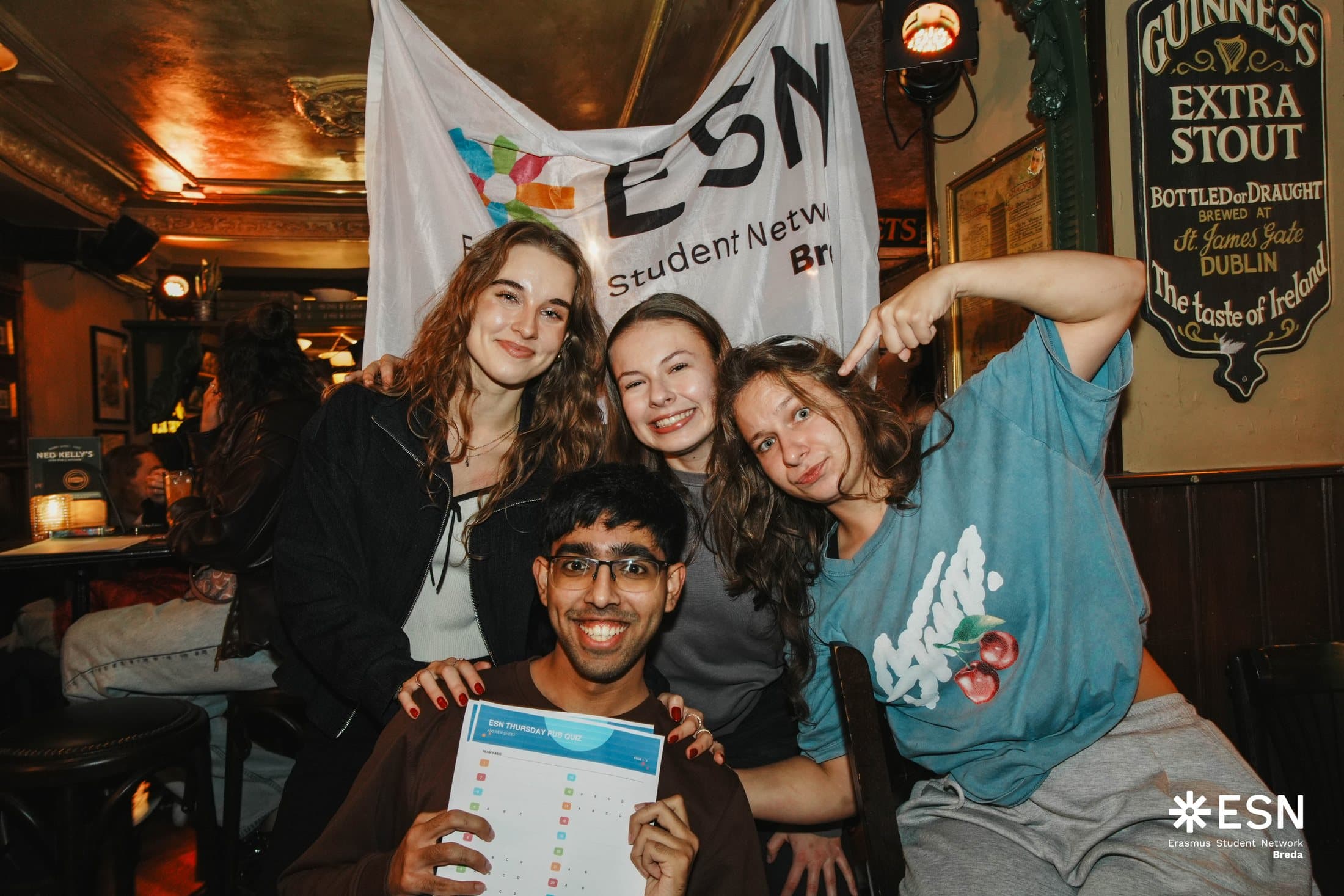 Kinga and the ESN Breda team celebrating with a pub quiz participant